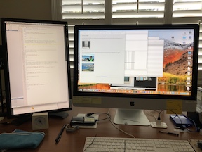 Dell monitor next to iMac